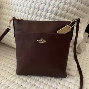 Coach cross body bag in eggplant. Beautiful bag!